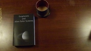 exoplanets book with coffee
